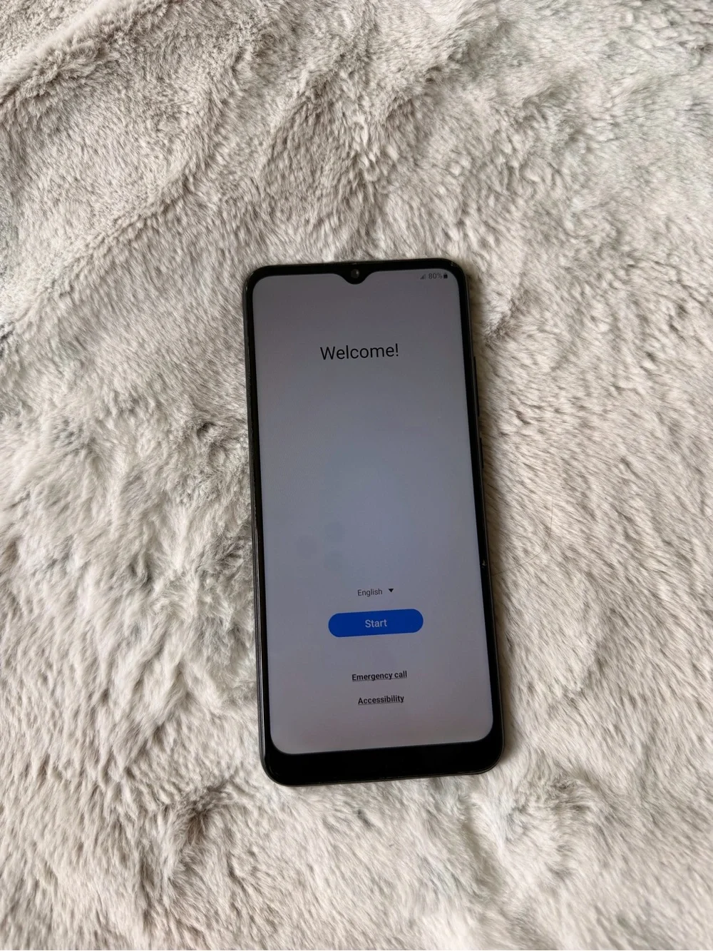 Samsung Black Smartphone with Blue Start Screen